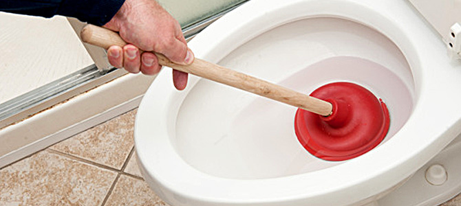 plunging a toilet - One Toronto Plumbing
