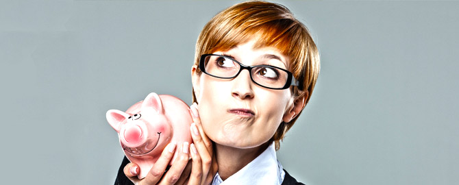 well-dressed woman holding her piggy bank wondering what it costs to hire scarborough plumbers