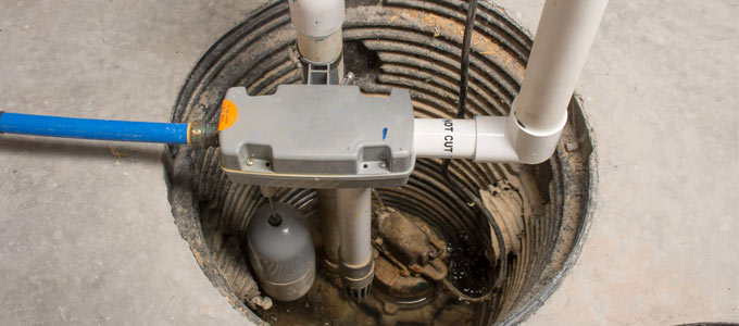 Sump pump inspection taking place in the basement of a Toronto home.